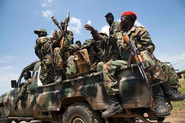 Soldiers of the Sudan People Liberation Army sit in a pick-up truck at the military base in Malakal, northern South Sudan, on October 16, 2016. FILE PHOTO | ALBERT GONZALEZ FARRAN | AFP